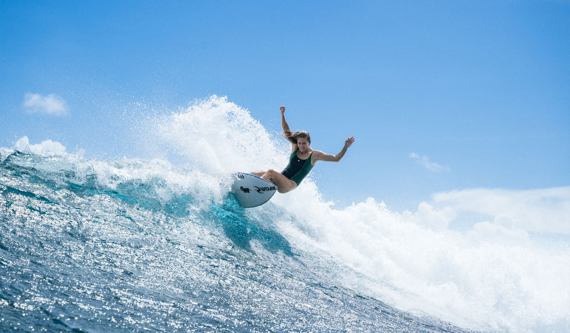 Women enjoying a surf and SUP retreat in Pembrokeshire